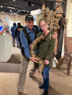 <p>New customers hamming it up with their new purchase of Jody Skeij’s metal creature!</p>