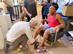 <p>This seriously fun lady felt like Cinderella with Mark helping her fit into her new shoes</p>