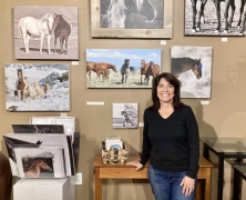 <p>Our Equine Photographer, Jody Miller in front of her new colorful photo of “Ears Pinned”.
</p>